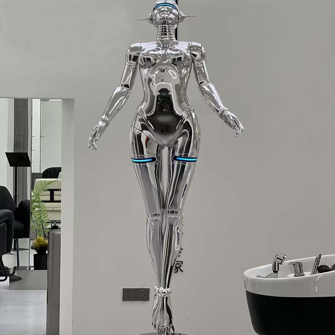 Sleek silver sculptural mannequin with modern design and futuristic details in a contemporary setting.
