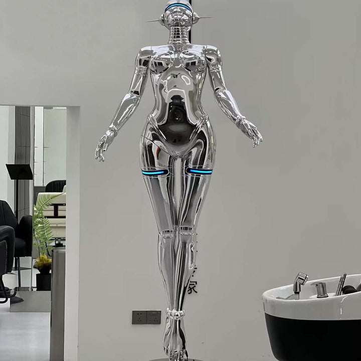 Sleek silver sculptural mannequin with modern design and futuristic details in a contemporary setting.