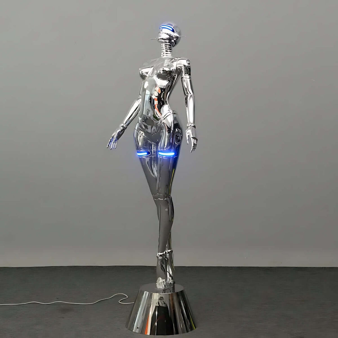 Sculptural Goddess Floor Lamp in silver, art deco design, perfect for trendy living room lighting.