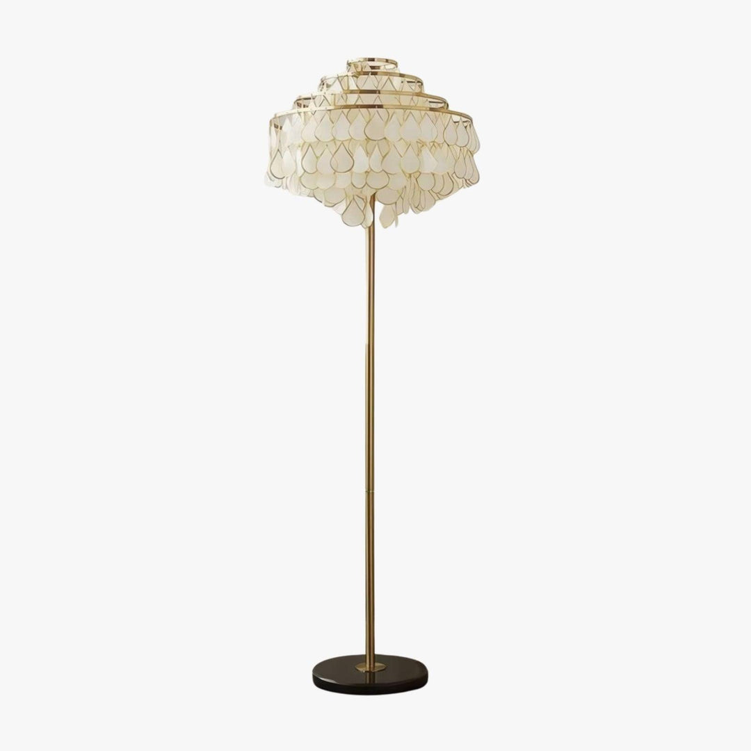 Coastal floor lamp featuring a decorative teardrop shell design, ideal for bedroom lighting or home decor.