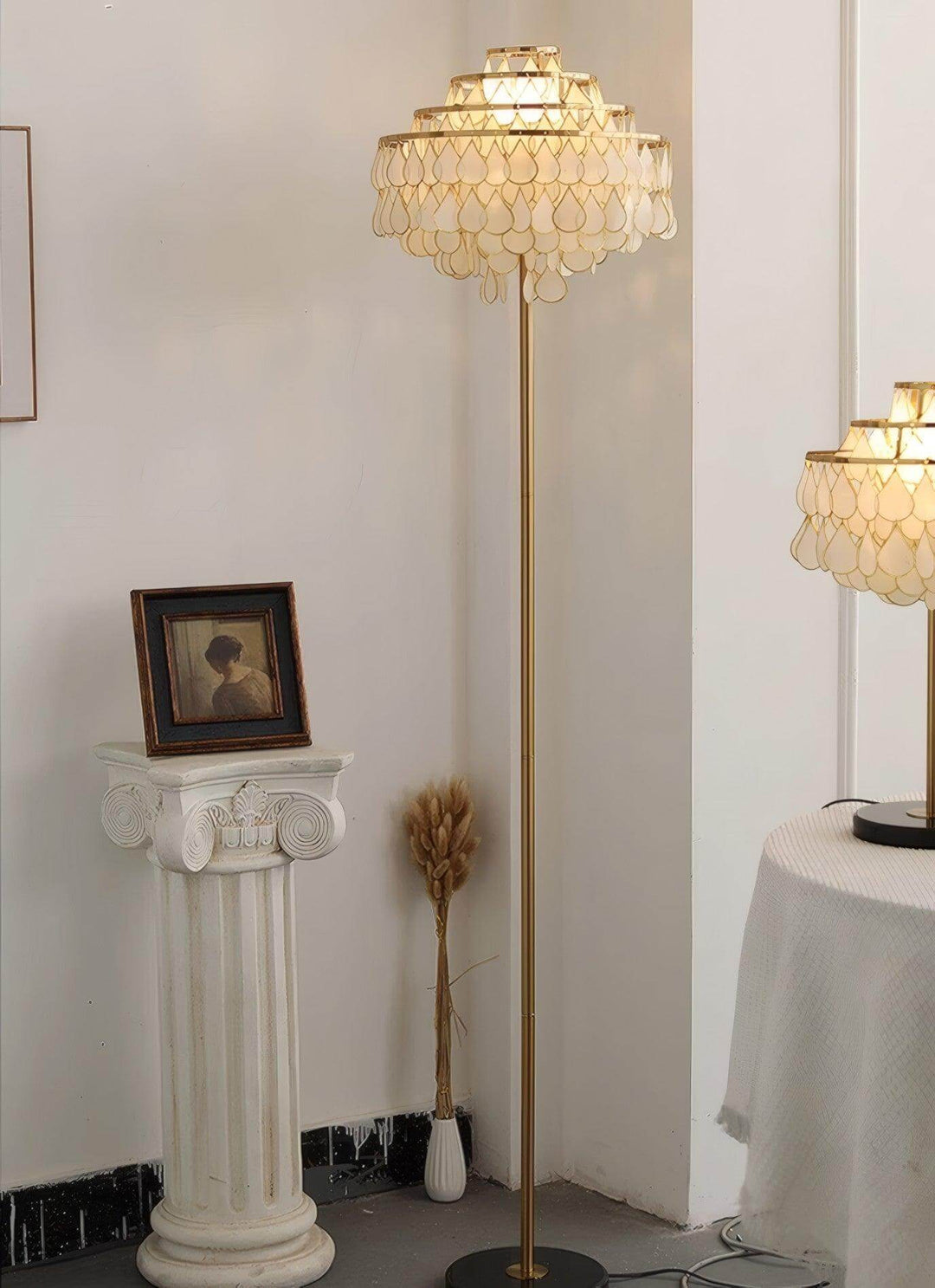 Coastal floor lamp with teardrop shell design, perfect decorative floor light for bedroom or living space.