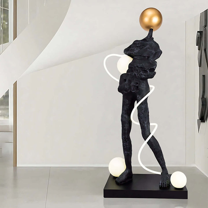 Sculptural floor lamp in art deco style, enhancing living room decor with artistic elegance and modern design.