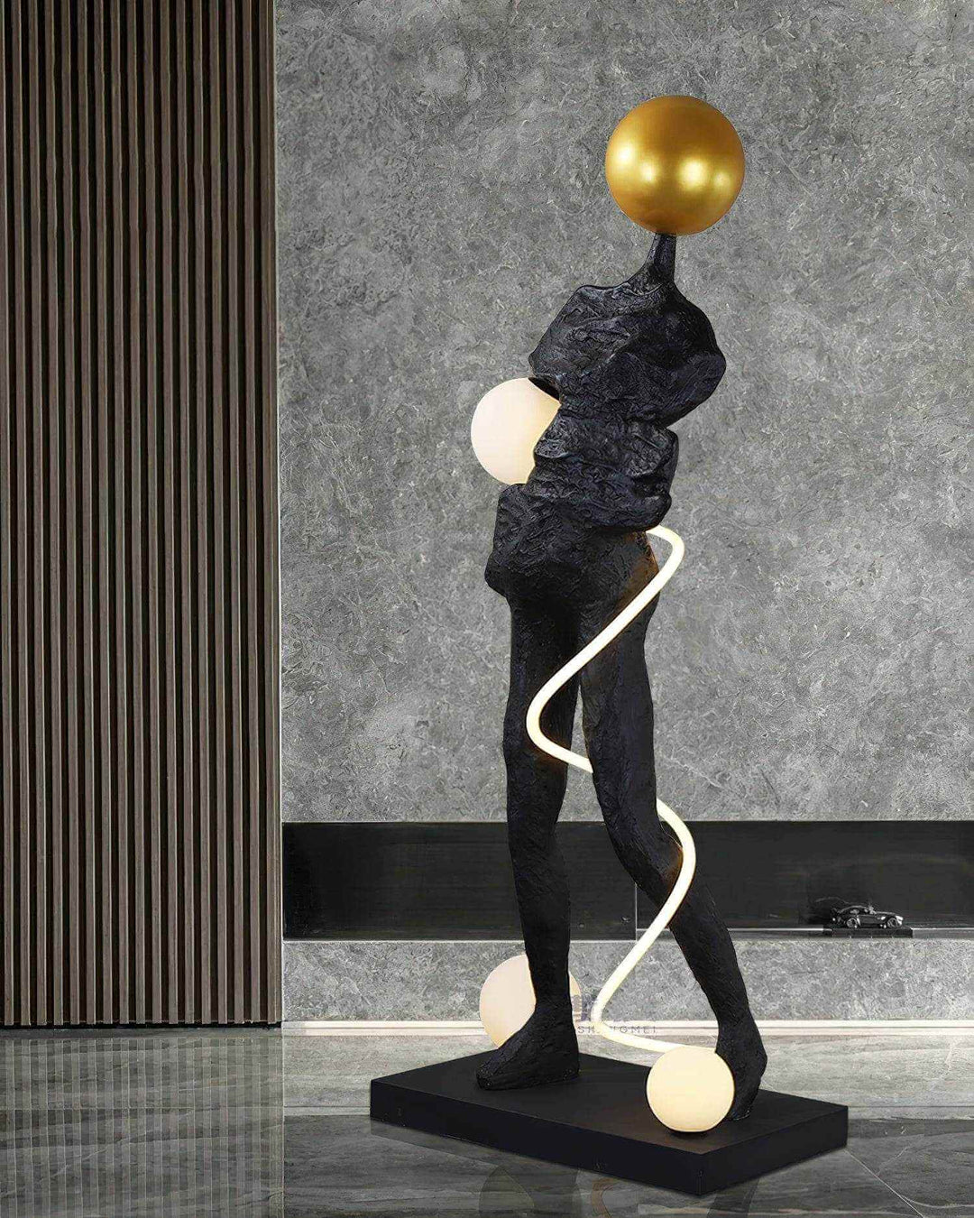 Sculptural floor lamp in art deco style, featuring a unique figure and elegant design, perfect for living room lighting.