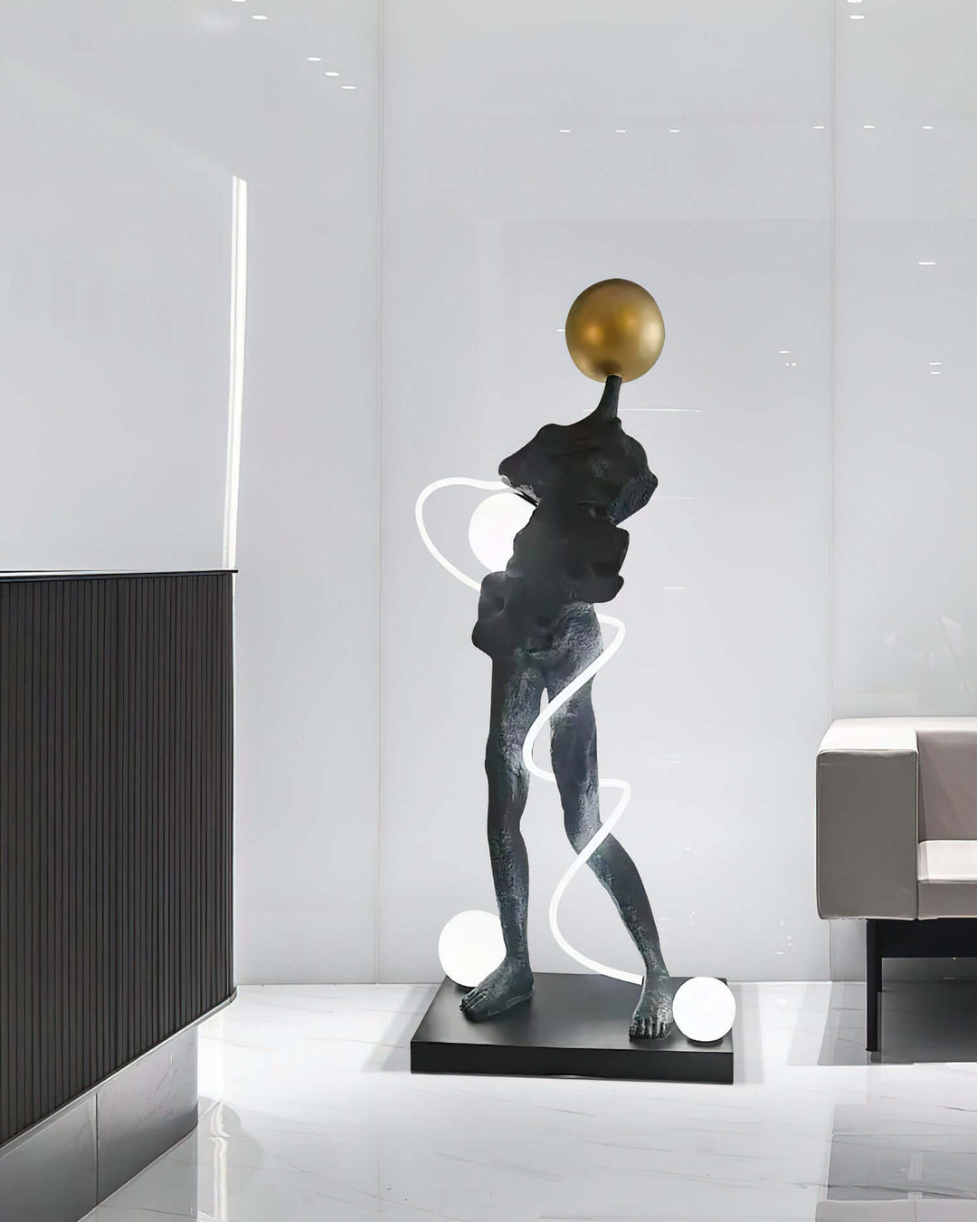 Sculptural floor lamp in modern setting, featuring a unique art deco design with gold accents and elegant curves.