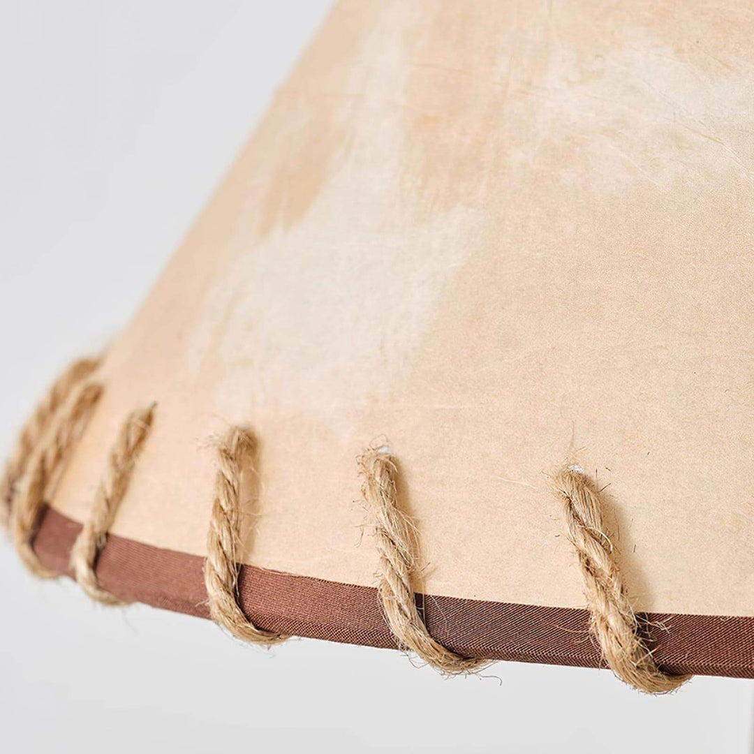 Close-up of beige lamp shade detailing with natural rope accents, showcasing rustic design suitable for farmhouse decor.