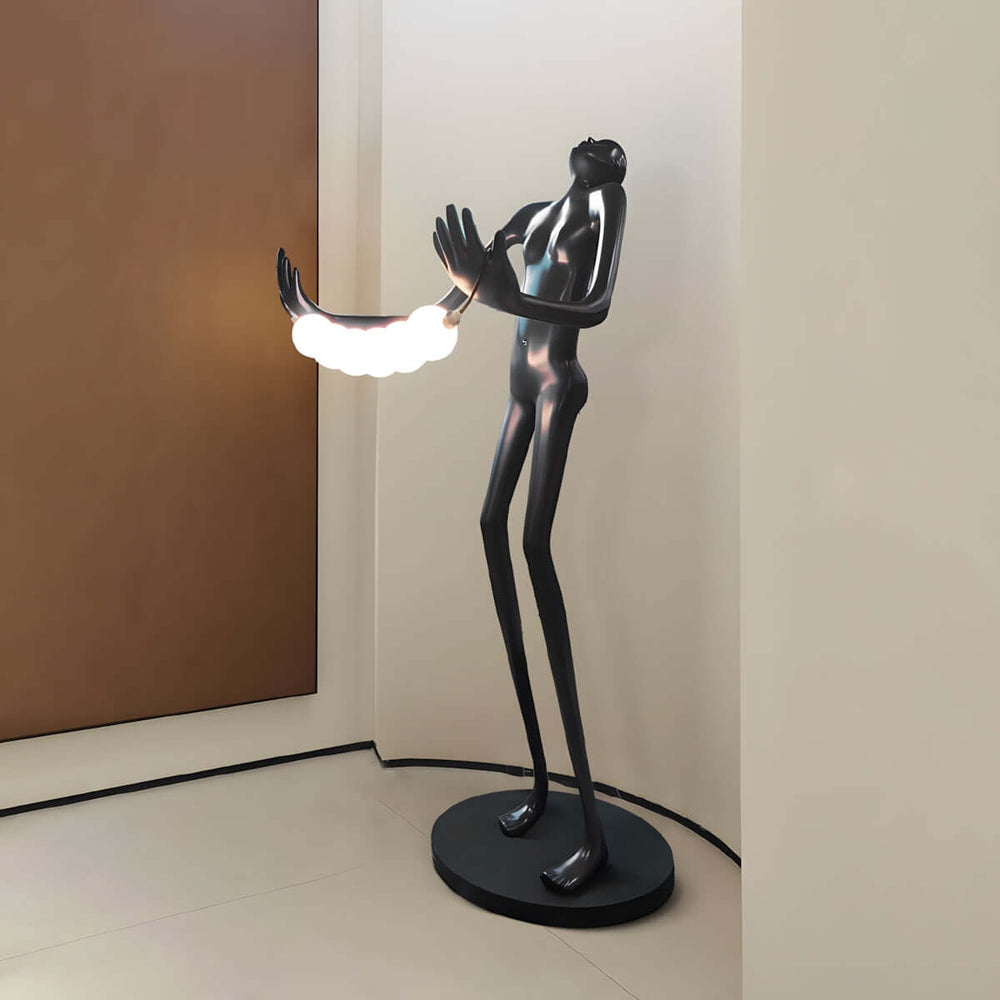 Klydor Art Floor Lamp, a sculptural black metal design adding elegance to living room decor.