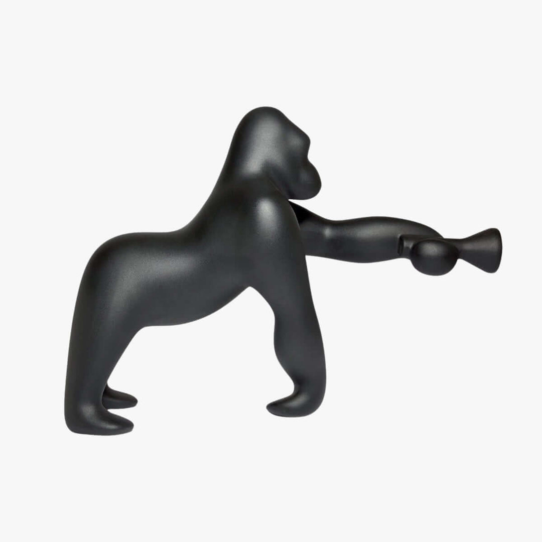 Black sculptural floor lamp shaped like a gorilla, perfect decorative light for modern living rooms.