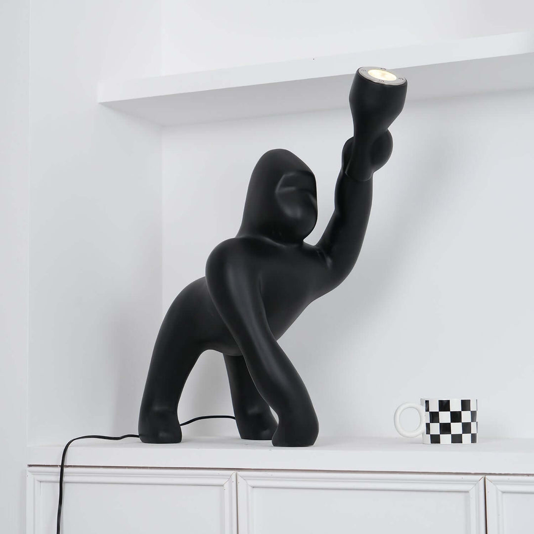 Kong sculpture floor lamp in black, a unique art deco floor light for modern living room decor.
