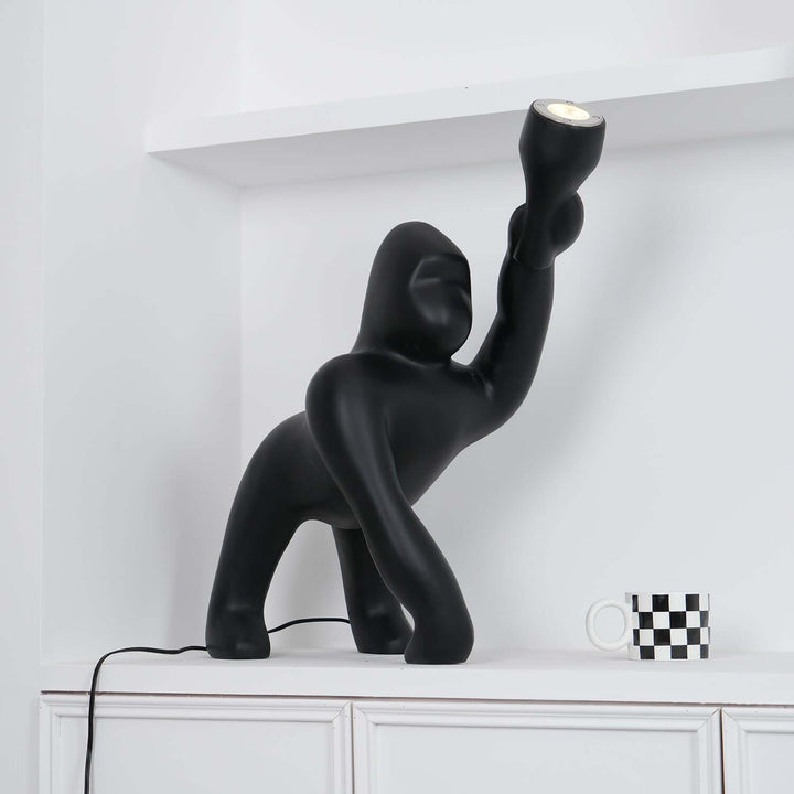 Kong sculpture floor lamp in black, a unique art deco floor light for modern living room decor.