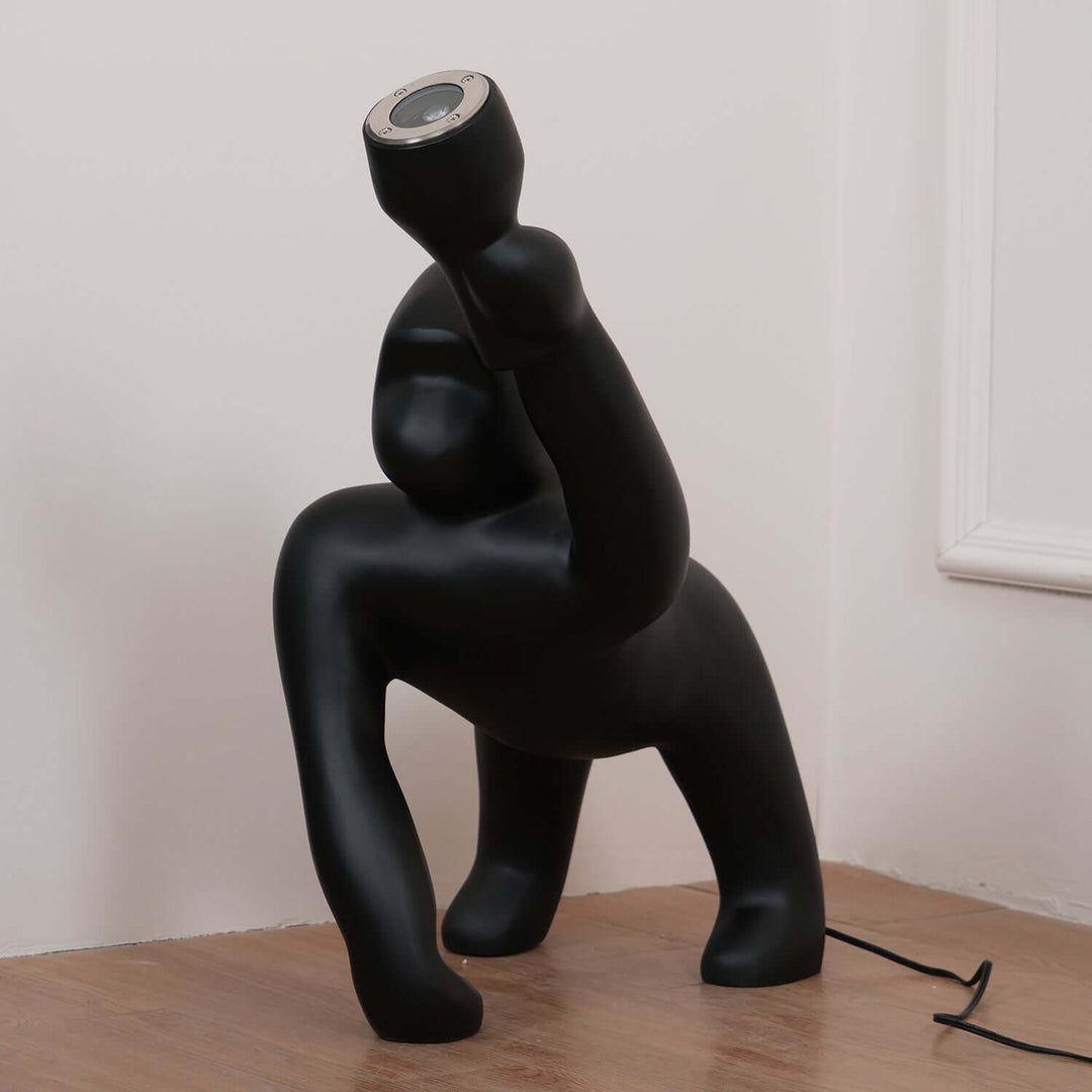 Kong sculpture floor lamp in black, showcasing a unique design, perfect for art deco decor and living room lighting.