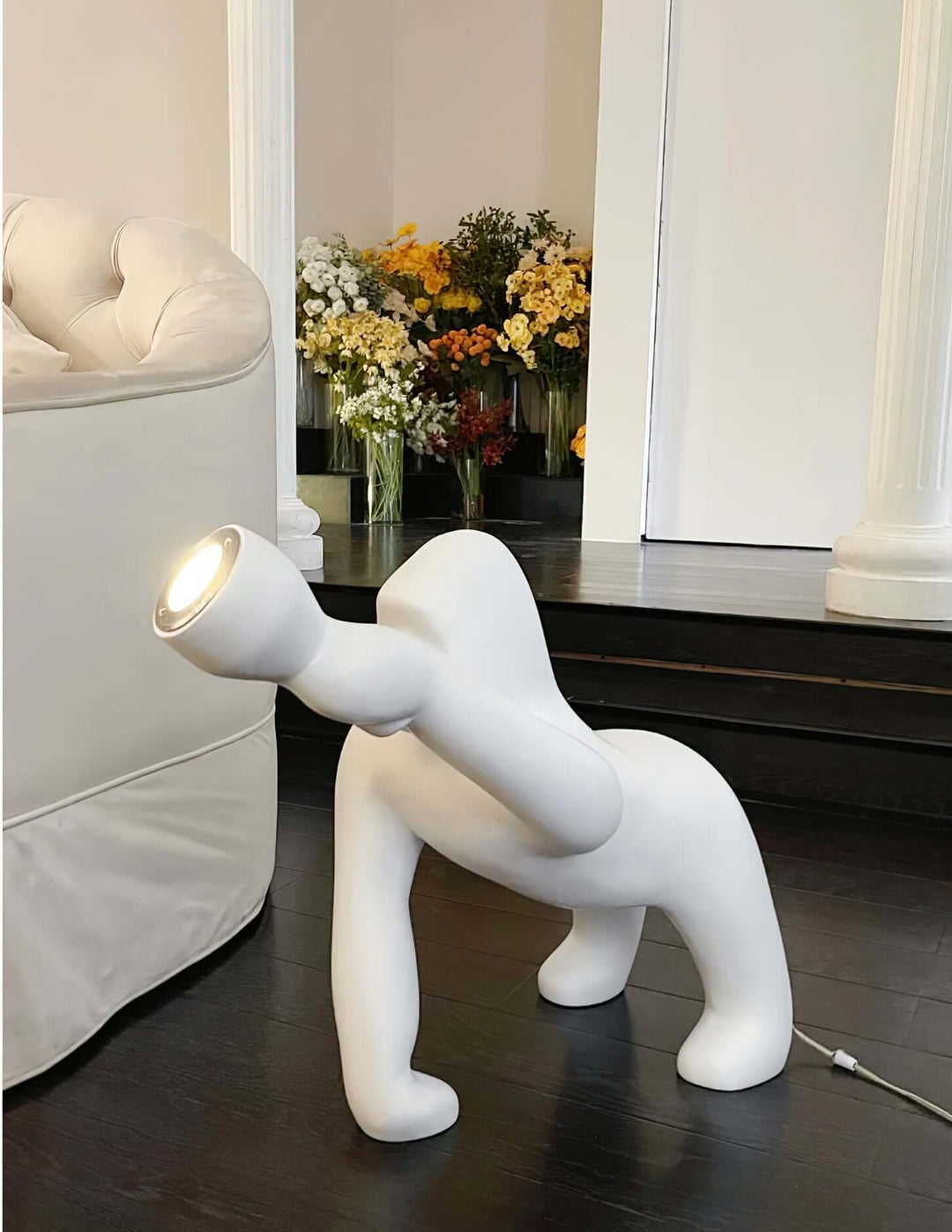 Kong sculpture floor lamp in white design, perfect for adding artistic flair to living room decor.