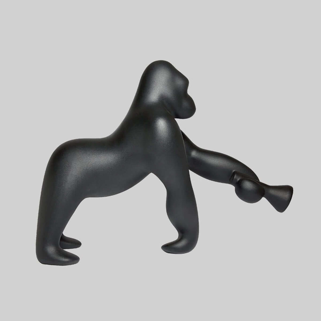 Black sculptural gorilla figurine, modern art decoration for home interiors.