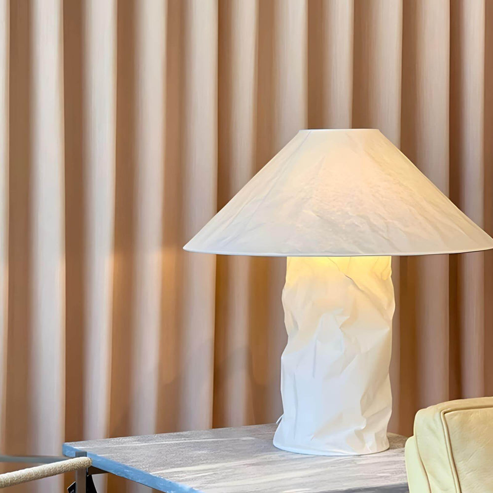 Minimal table lamp in white, perfect for bedroom bedside lighting, showcasing a unique crumpled design.