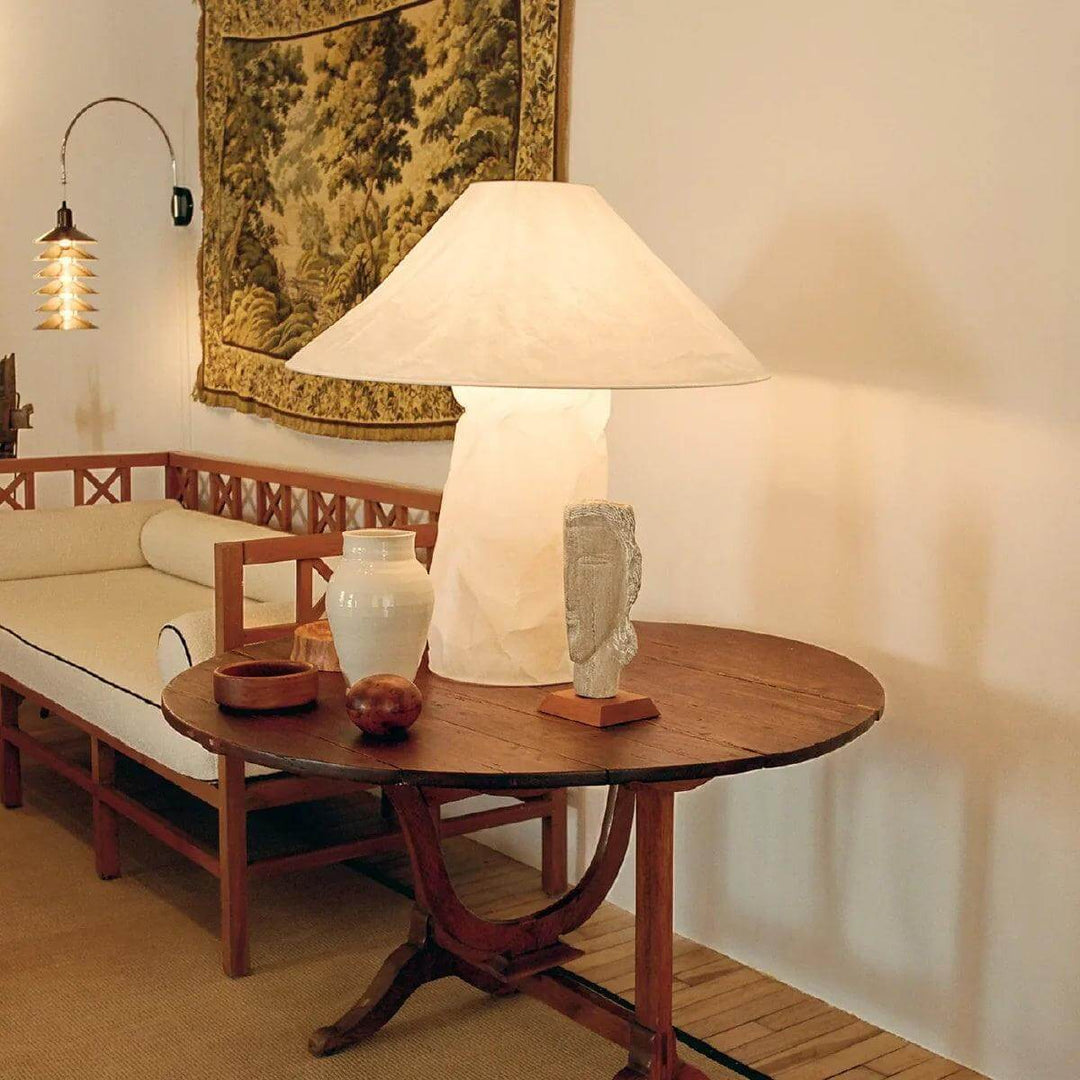 Minimal table lamp in white on a rustic wooden table, ideal for bedroom bedside decor.