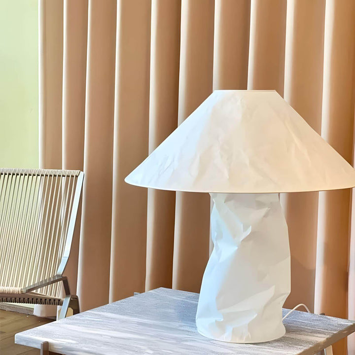 Minimal table lamp in white, featuring a unique crumpled design, perfect for bedroom bedside lighting.