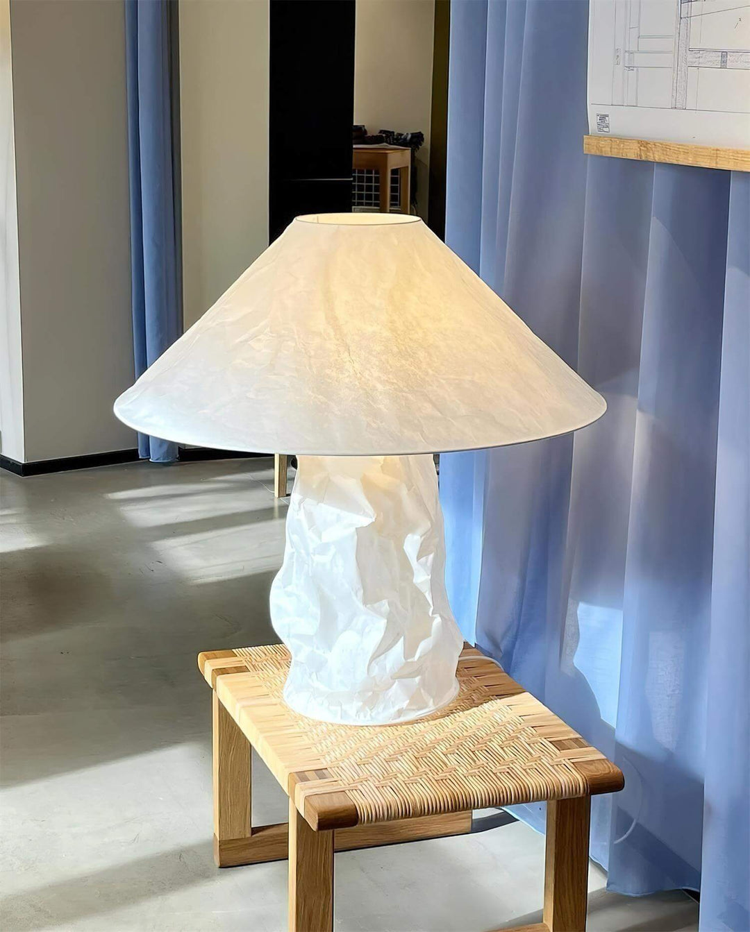 Minimal table lamp with white crumpled texture shade, ideal for bedroom bedside use.