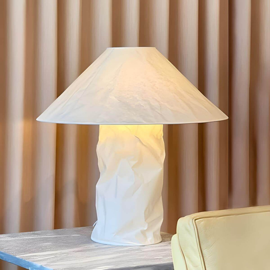 Minimal white table lamp on side table, perfect for bedroom bedside lighting.