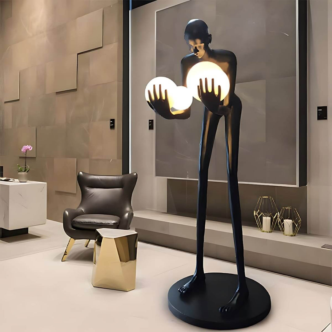 Light Guardian Floor Lamp in a modern living room, featuring a resin sculpture and Art Deco design.