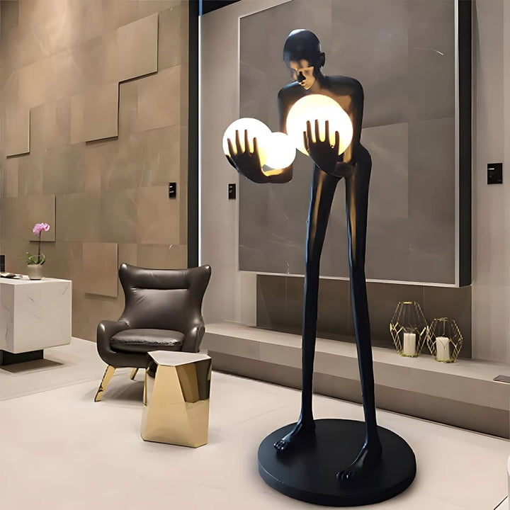 Light Guardian Floor Lamp in a modern living room, featuring a resin sculpture and Art Deco design.