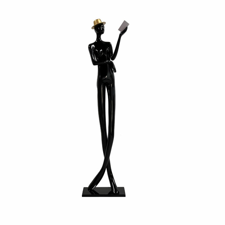 Sculptural floor lamp featuring a tall black figure reading a book, perfect for modern art deco decor.