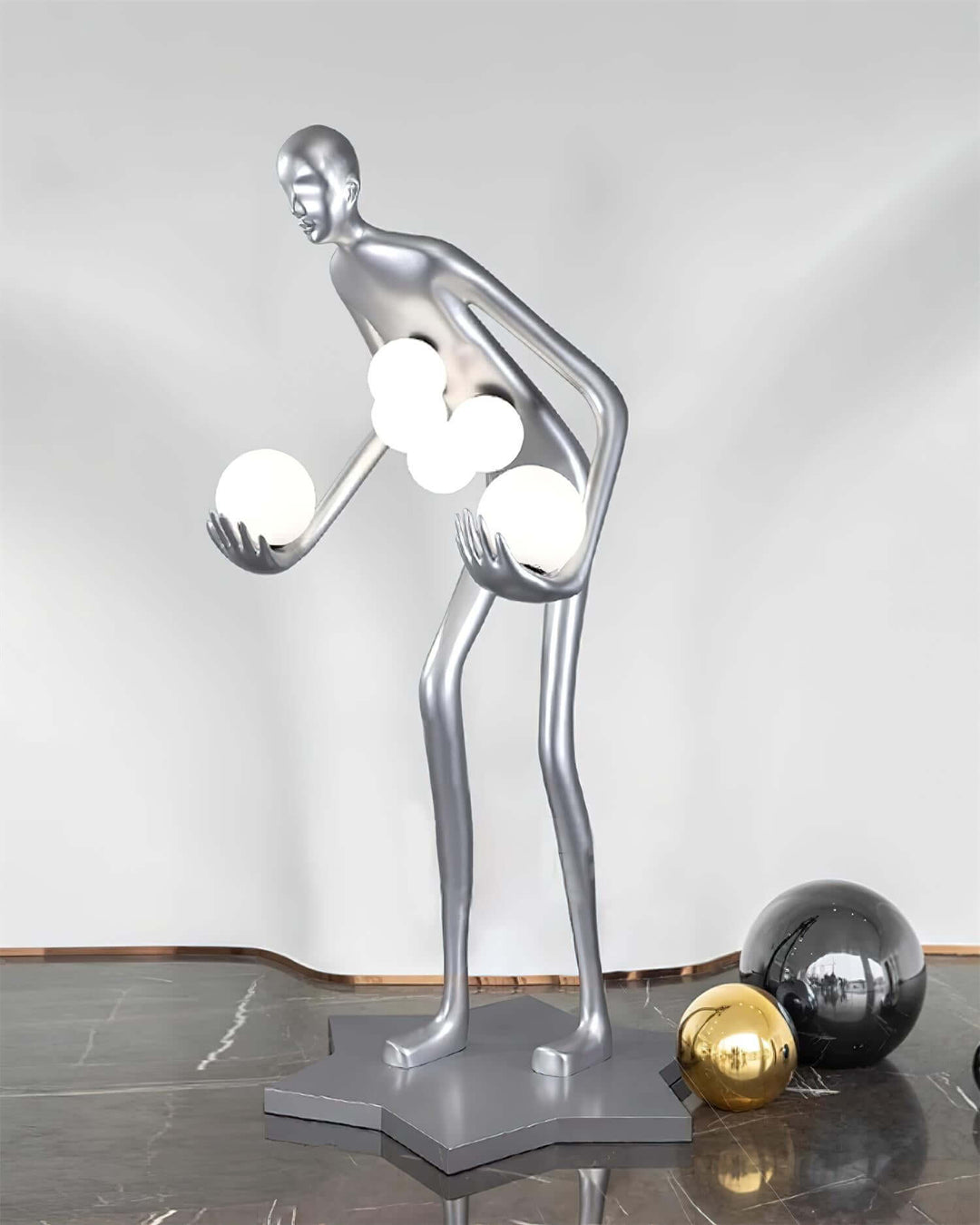 Sculptural floor lamp in the shape of a figure holding glowing orbs, perfect for modern art deco living room lighting.