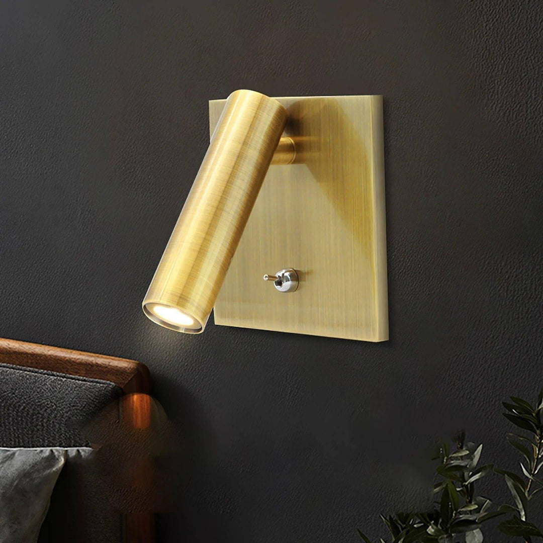 Modern brass flush mount wall sconce with adjustable reading lamp design, perfect for minimalist bedside lighting.