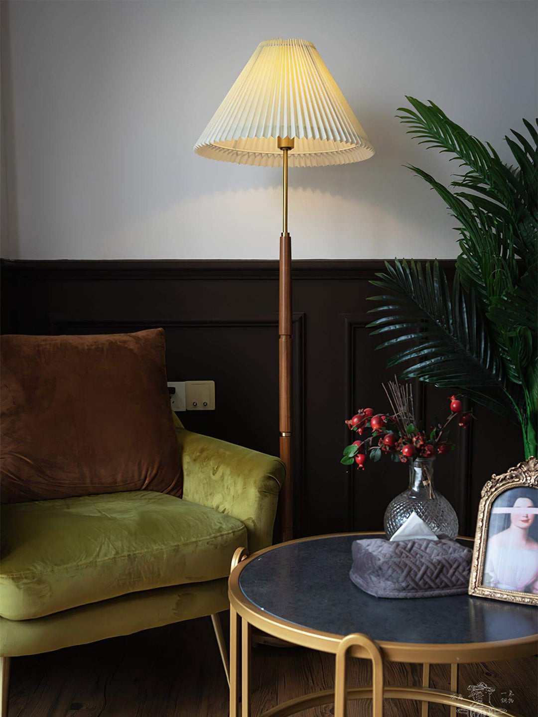 Mid Century pleated floor lamp in stylish living room setting with green chair and decorative plants.