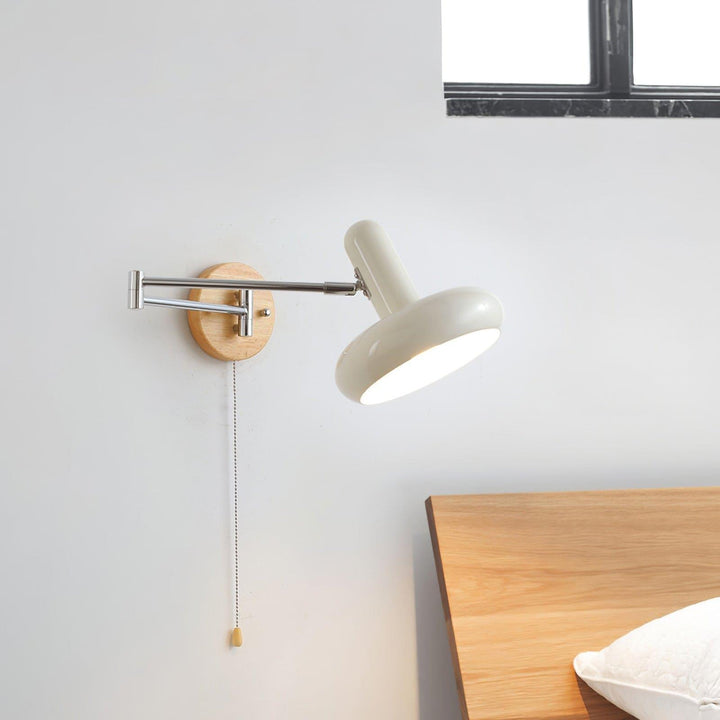 Mitzi Maddie Wall Lamp, a modern white articulating wall sconce for stylish wall mounted reading lights.