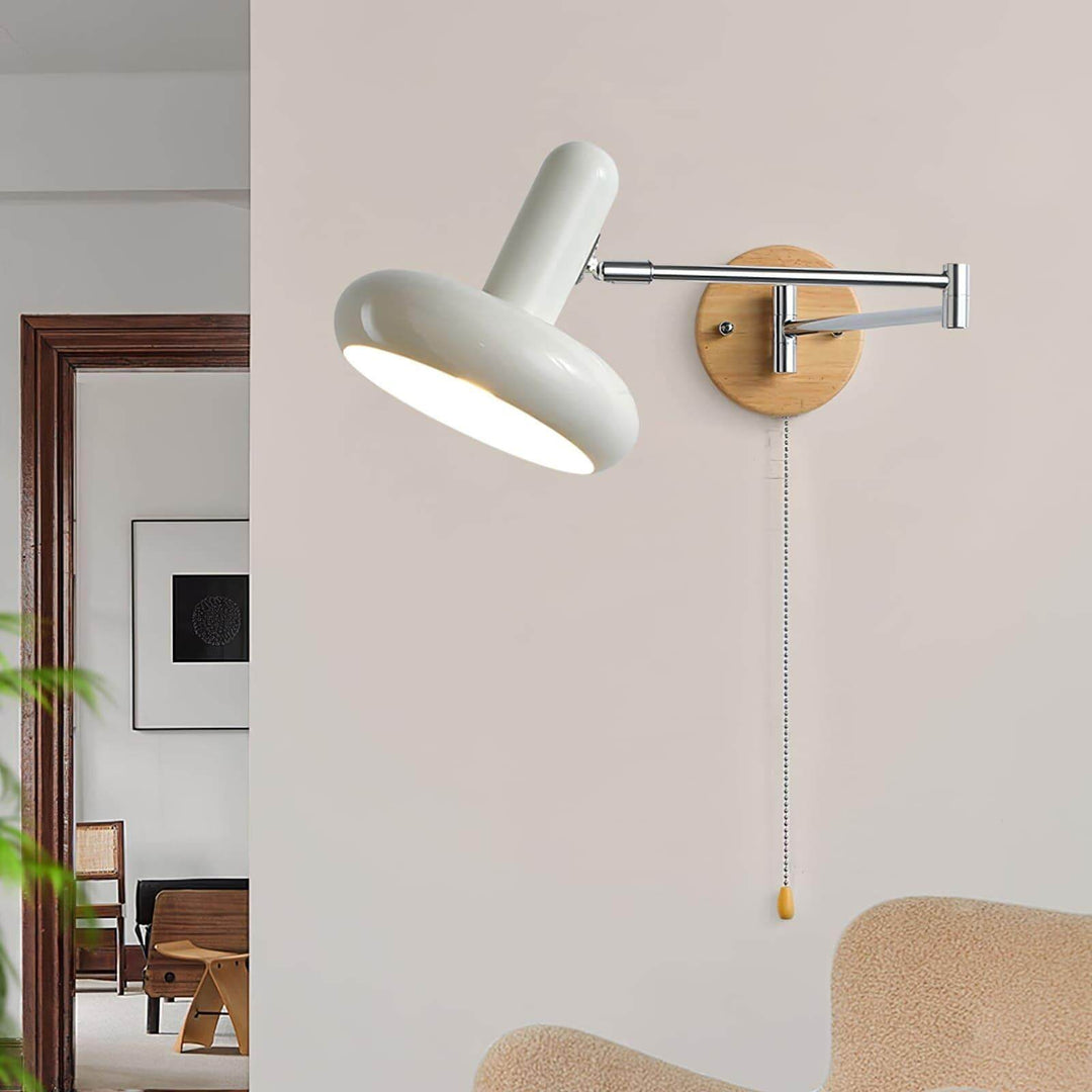 Mitzi Maddie wall lamp in modern interior, white articulating wall sconce with wooden base, perfect for reading.
