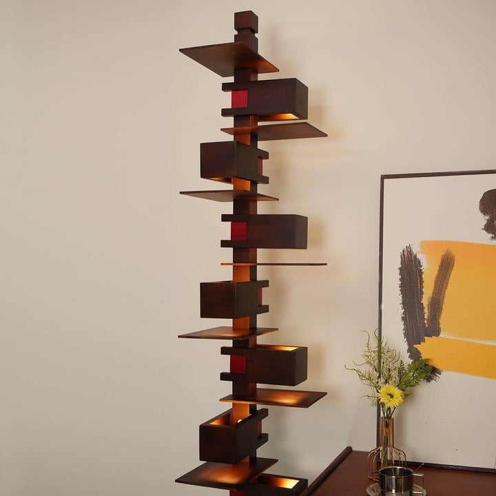 Taliesin floor lamp featuring an art deco design, a tall wooden structure with warm floor lights, ideal for living room decor.