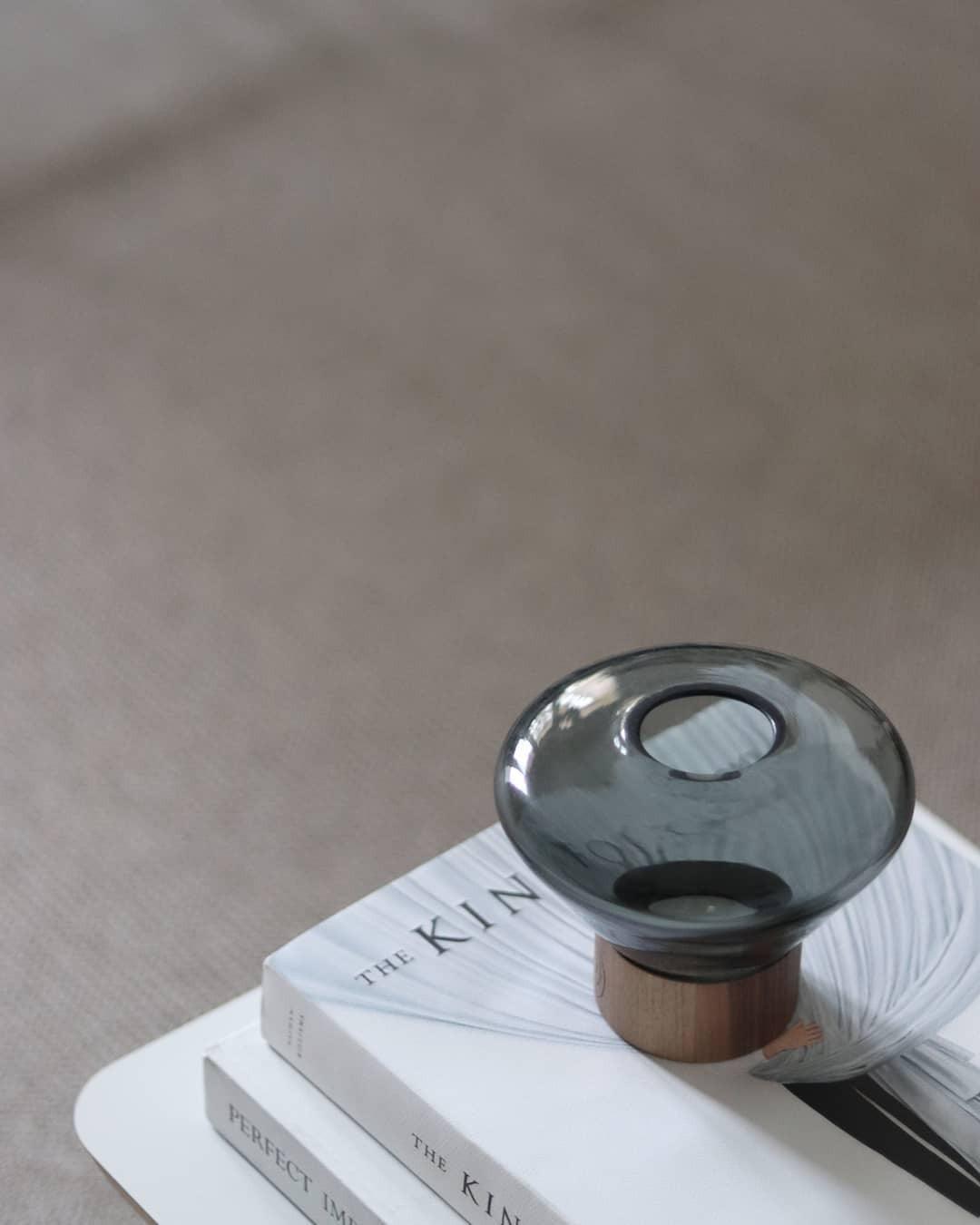 Art Deco Muffins Table Lamp, round glass design on stack of books, stylish table light for living room.