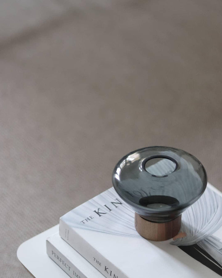 Art Deco Muffins Table Lamp, round glass design on stack of books, stylish table light for living room.