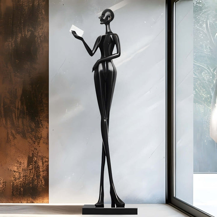 Muse Noir sculpture in a modern living room, Art Deco resin decorative ornament, tall stylish figure.