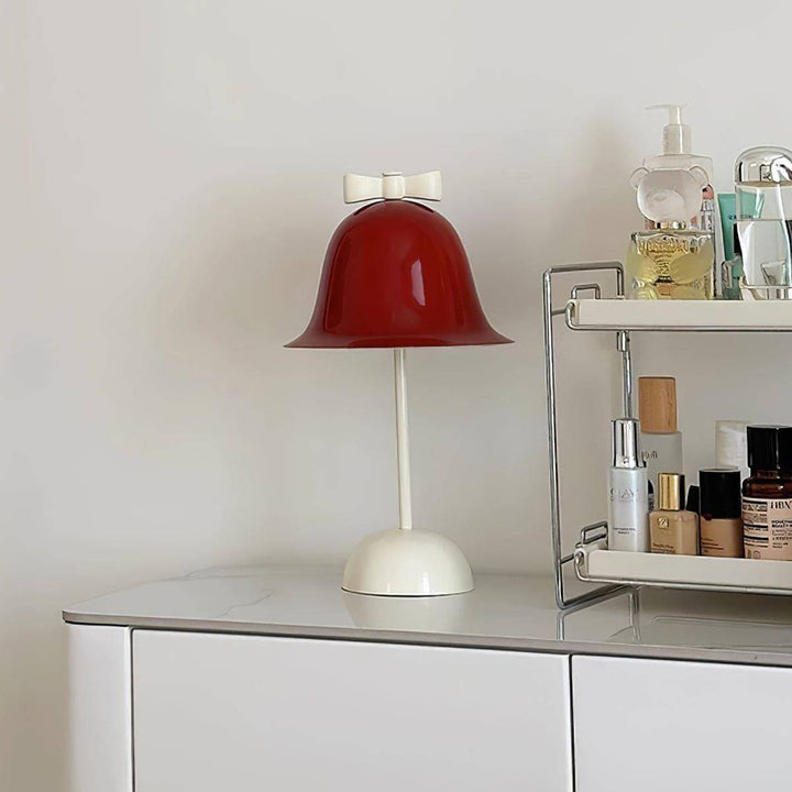 Charming red lamp with bow, perfect for bedside or dining table, a stylish accent for any modern decor.