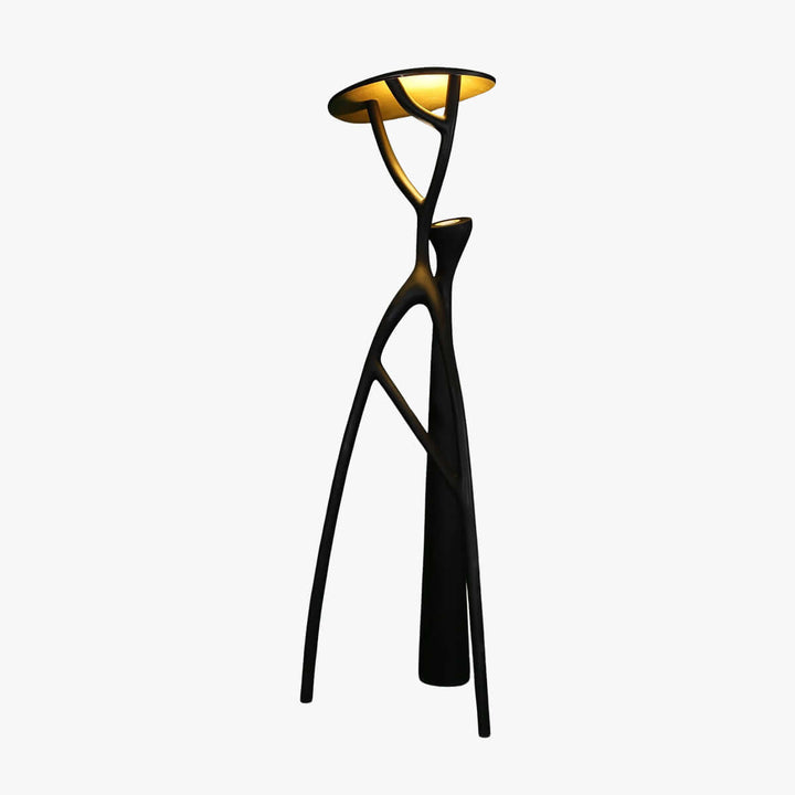 Sculptural floor lamp with tripod design, perfect for art deco style living room lighting.