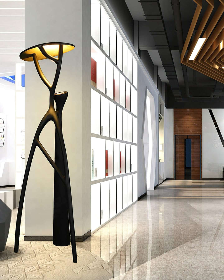 Nivaro resin floor lamp in a modern hallway, showcasing its sculptural design and art deco style.