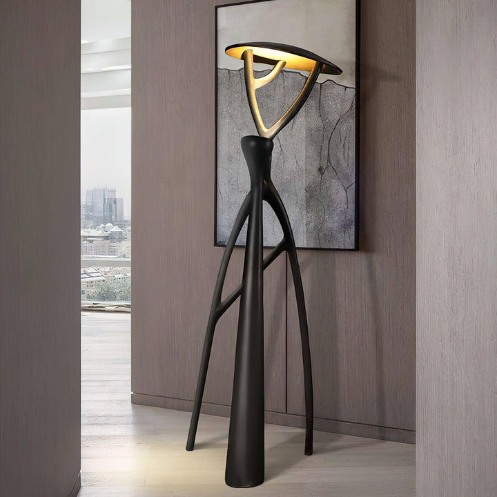 Nivaro sculptural art deco floor lamp for modern living room featuring a tripod design and stylish illumination.