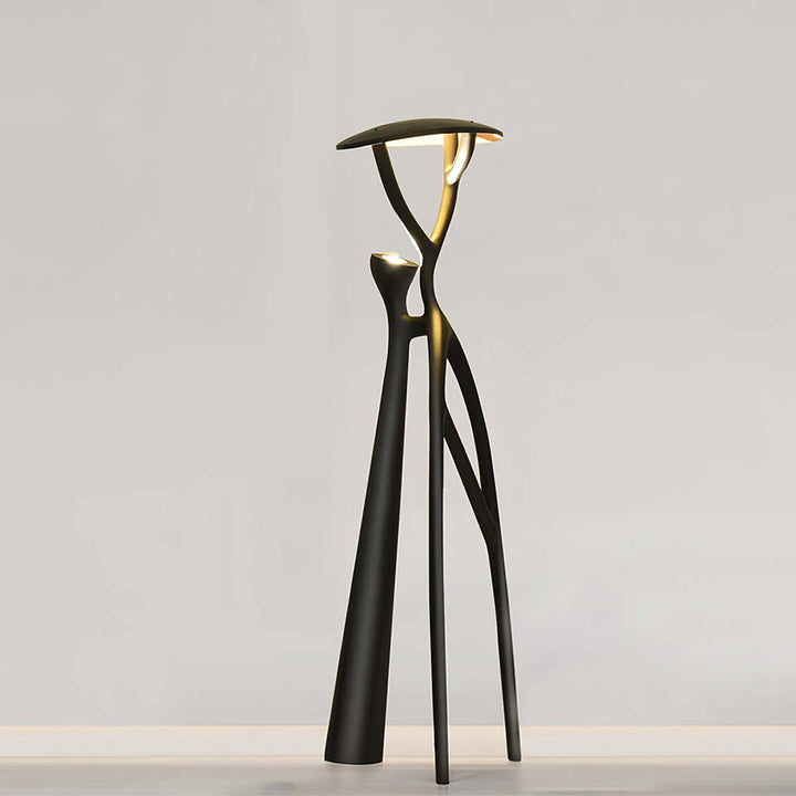 Sculptural Nivaro resin floor lamp with tripod design, perfect for living rooms. Art deco style and modern floor lighting.