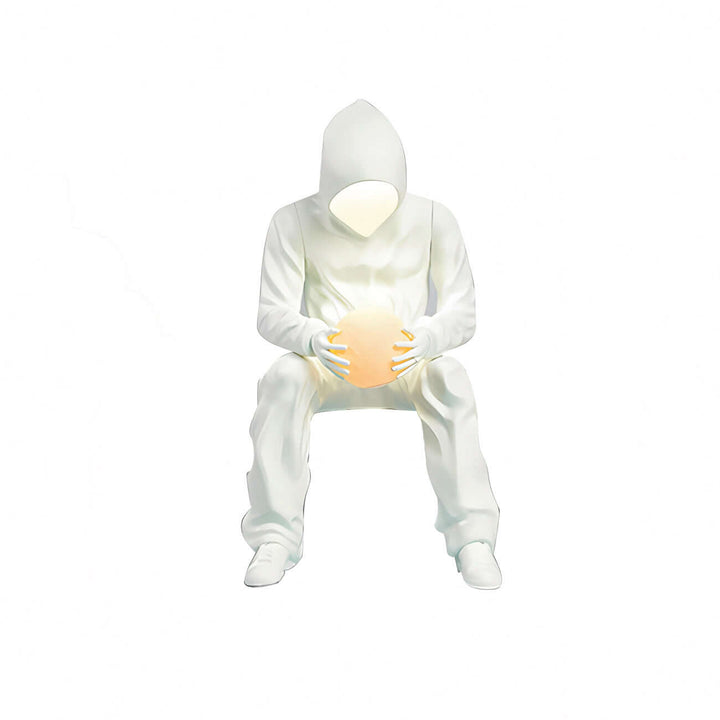 Unique art deco floor lamp featuring a sculptural figure holding a glowing orb, perfect for modern living room decor.