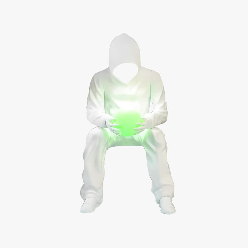 Sculptural floor lamp design featuring a seated figure holding a glowing green orb, perfect for modern living spaces.