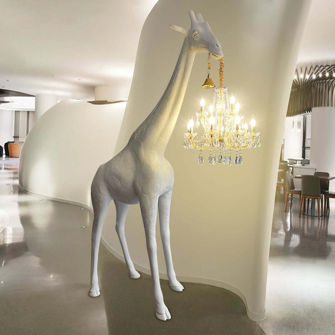 Sculptural giraffe floor lamp holding a chandelier, modern art deco design for stylish living room lighting.