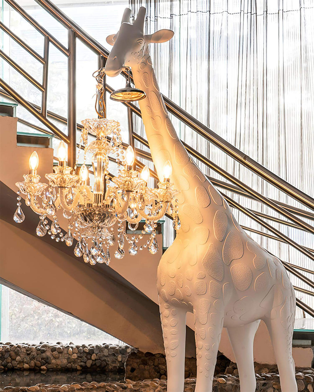 Nuvexa Giraffe Floor Lamp, a sculptural art deco piece, illuminates a modern living room with elegance and charm.