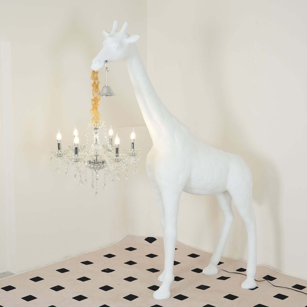 White sculptural giraffe floor lamp with chandelier, adding artistic flair to modern living spaces.