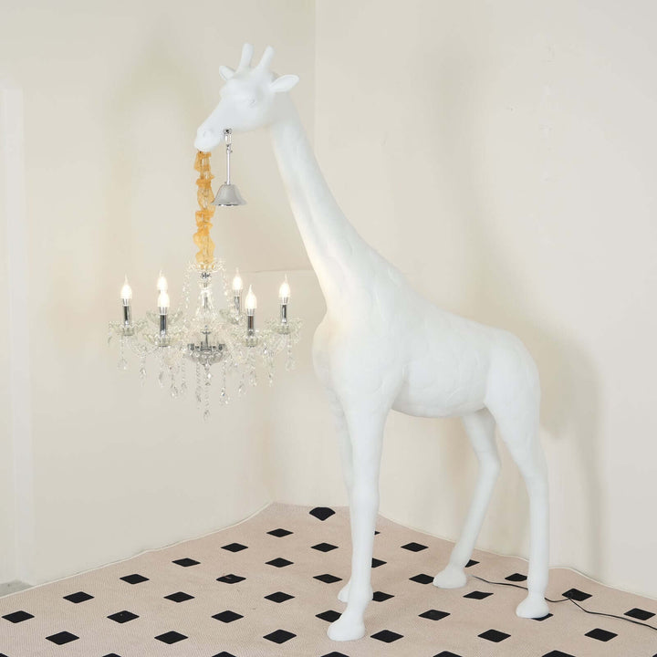 White sculptural giraffe floor lamp with chandelier, adding artistic flair to modern living spaces.