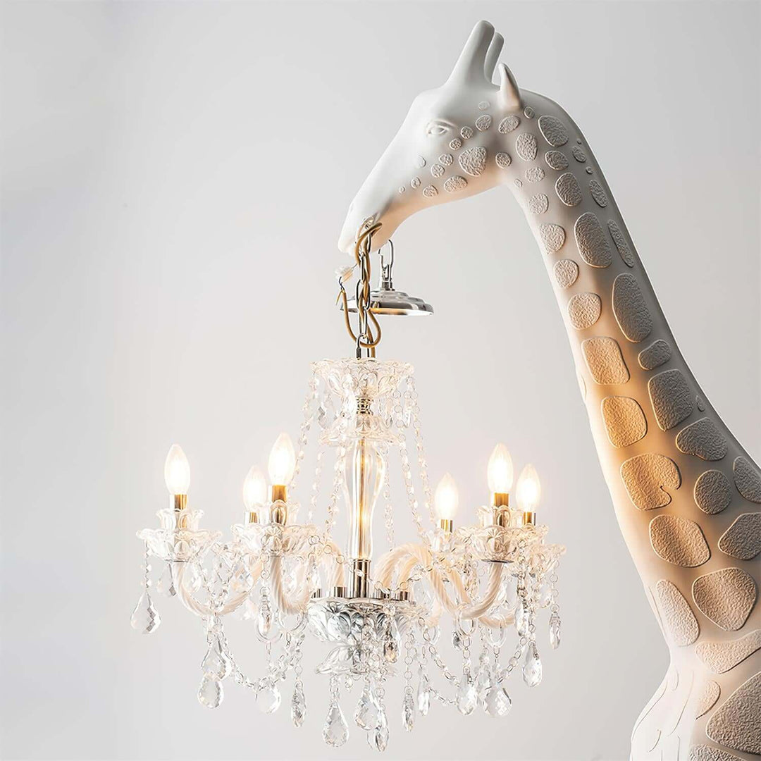 Art deco giraffe sculpture floor lamp with crystal chandelier details and warm lighting for unique living room decor.