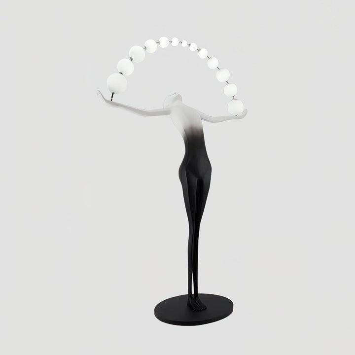 Olyvra sculptural floor lamp in art deco style with white spheres and black base, ideal for modern living room lighting.