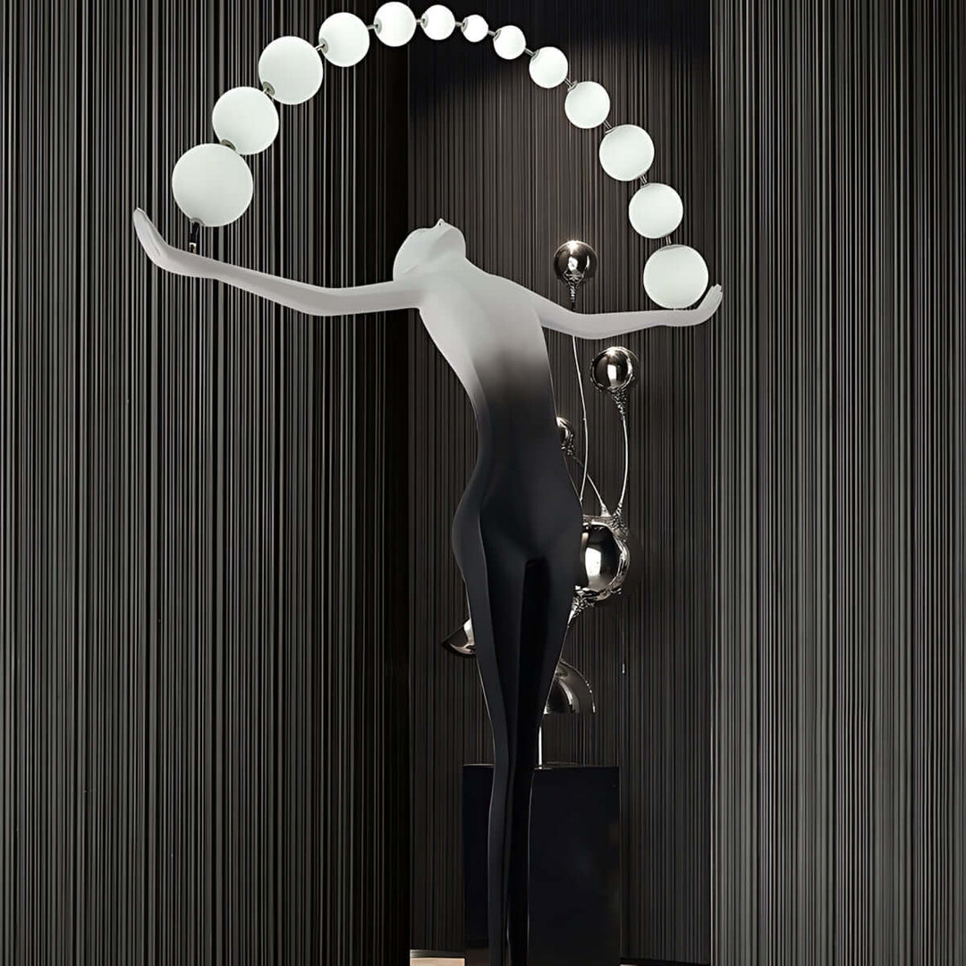 Olyvra sculptural floor lamp with artistic design, featuring globe lights, ideal for modern living room decor.