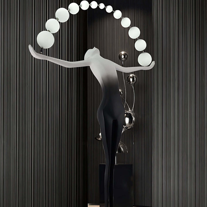Olyvra sculptural floor lamp with artistic design, featuring globe lights, ideal for modern living room decor.