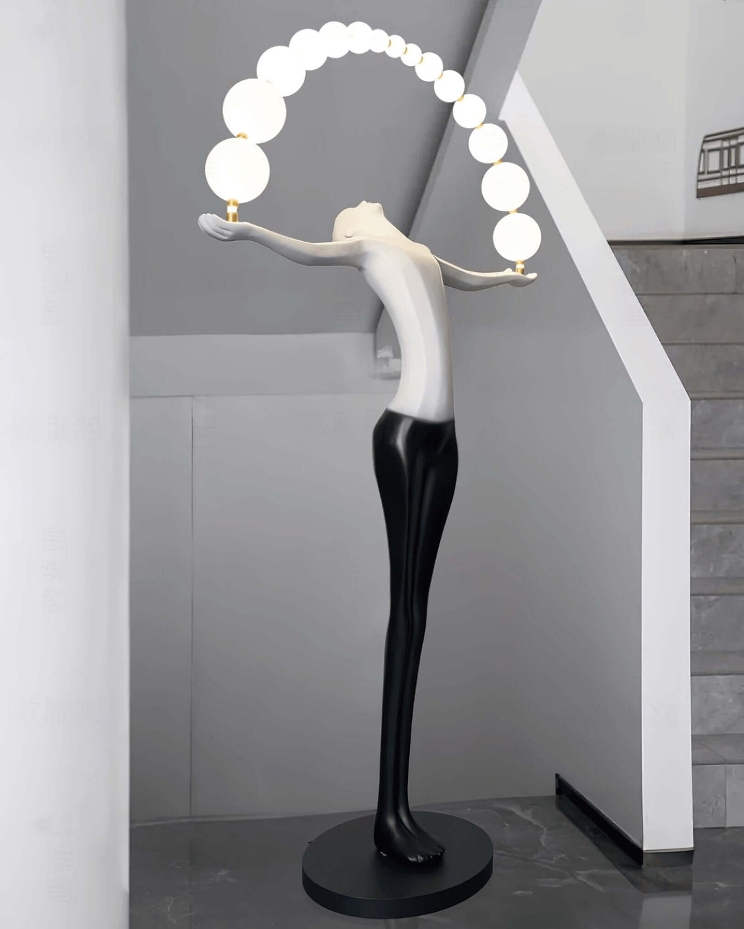 Olyvra sculptural floor lamp with art deco design, bright orbs, perfect for modern living room decor.