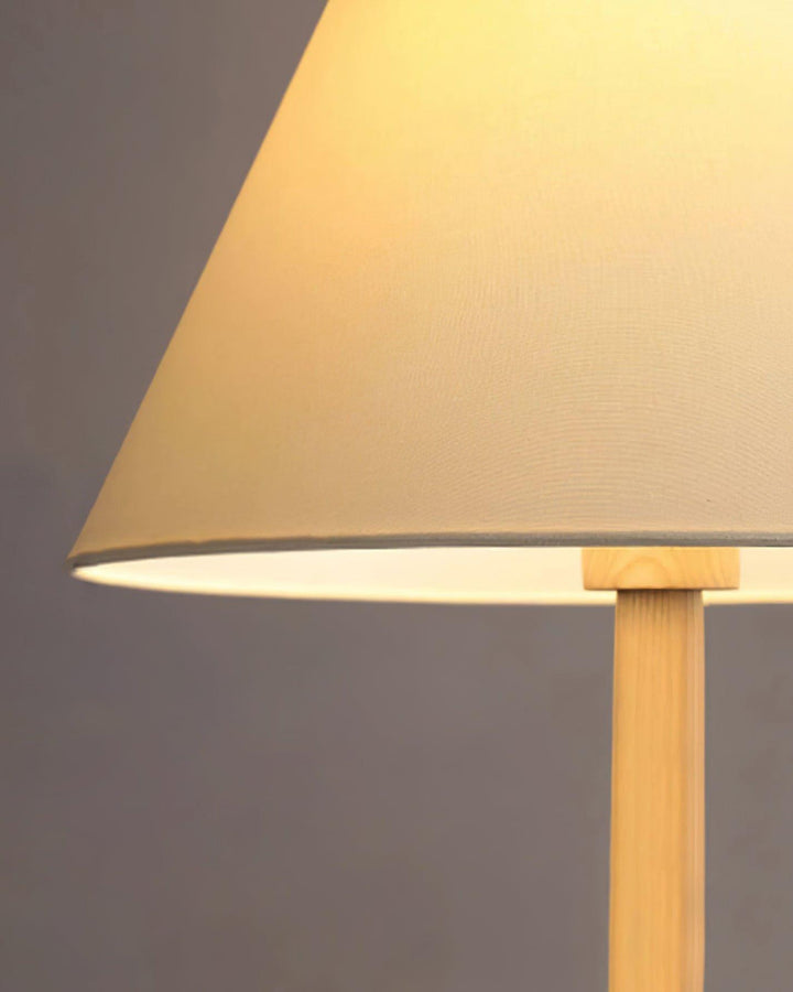Close-up of the Osaka Floor Lamp's beige shade and wooden base, perfect for adding rustic elegance to any living room.